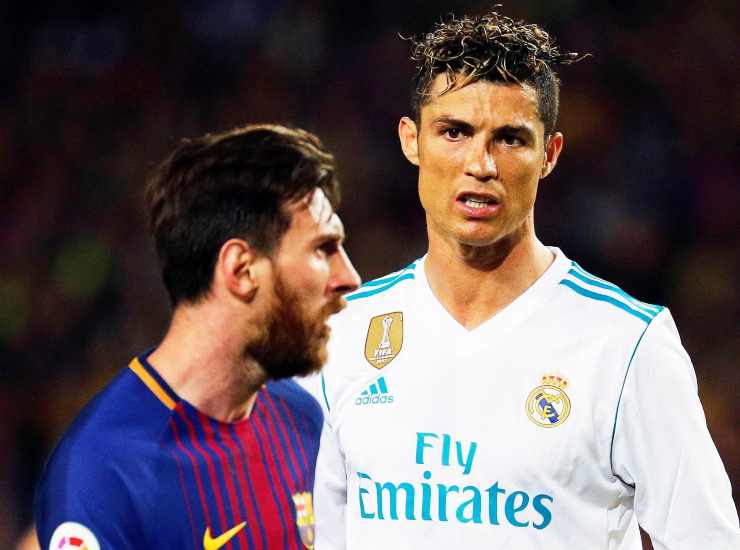 Messi e Cristiano Ronaldo l'uno contro l'altro - credits: Ansa Foto. Il Calcio Magazine